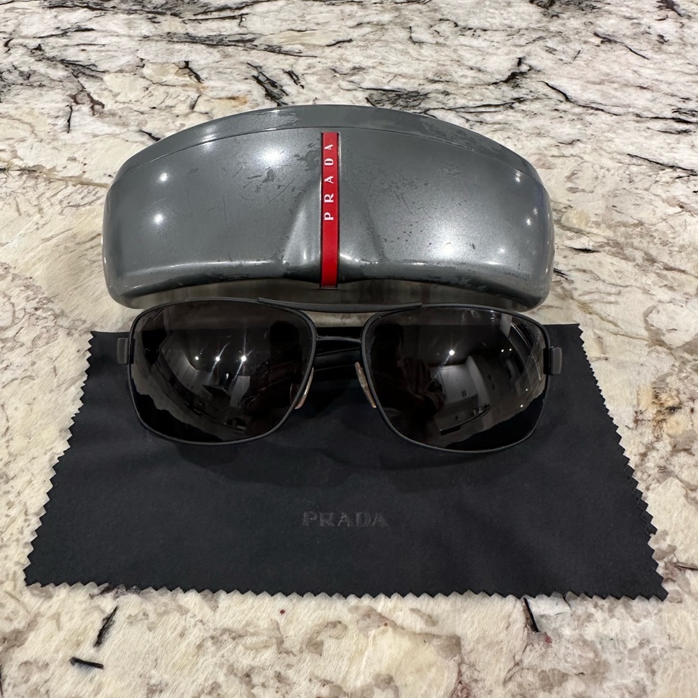 Men’s Prada sunglasses. Matte black w/ polarized lenses. Case & dust cloth.